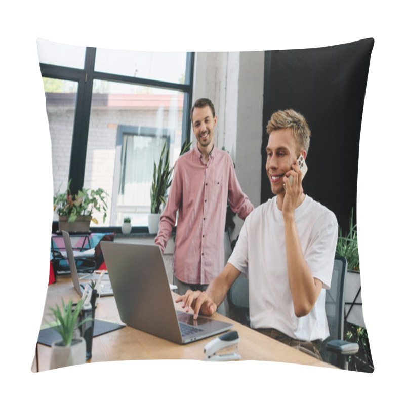 Personality  A Cheerful Young Man Talks On The Phone While His Partner Smiles, Creating A Productive Atmosphere. Pillow Covers