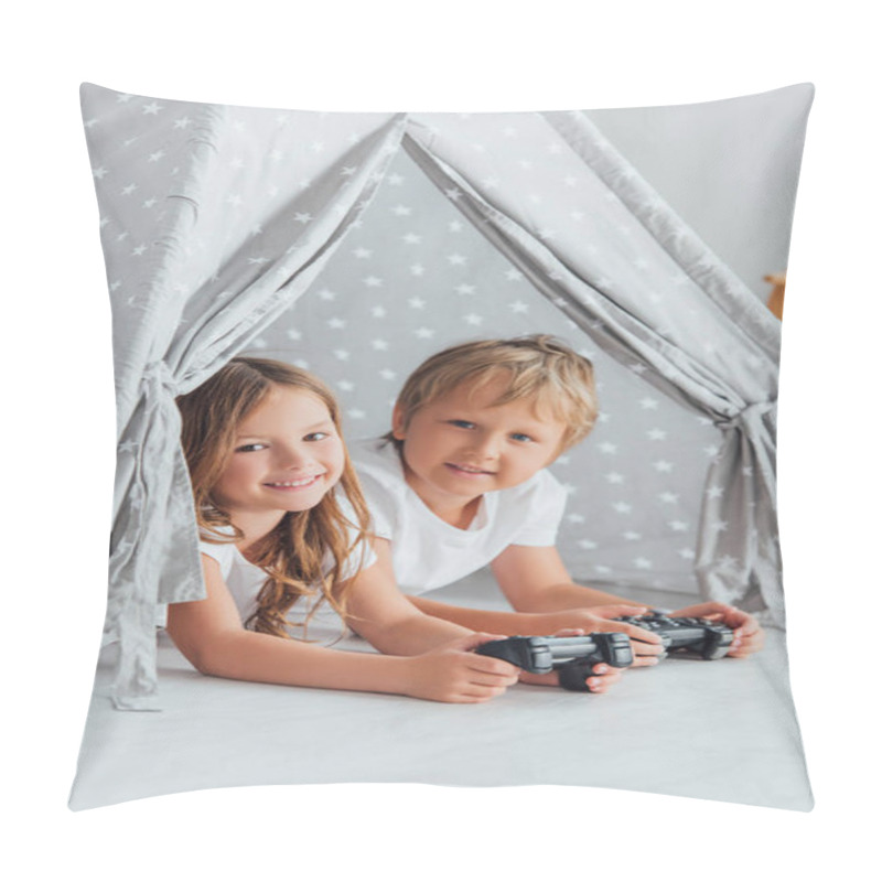 Personality  KYIV, UKRAINE - JULY 21, 2020: Brother And Sister Looking At Camera While Lying In Kids Wigwam With Joysticks Pillow Covers