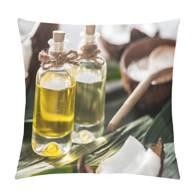 Personality  Selective Focus Of Bottles With Coconut Oil Near Cracked Coconuts On Green Palm Leaves Pillow Covers