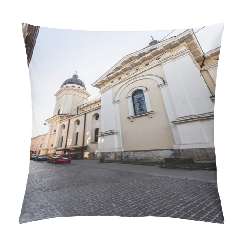 Personality  LVIV, UKRAINE - OCTOBER 23, 2019: Carmelite Monastery Wall And Church, And Cars Parked On Street Pillow Covers