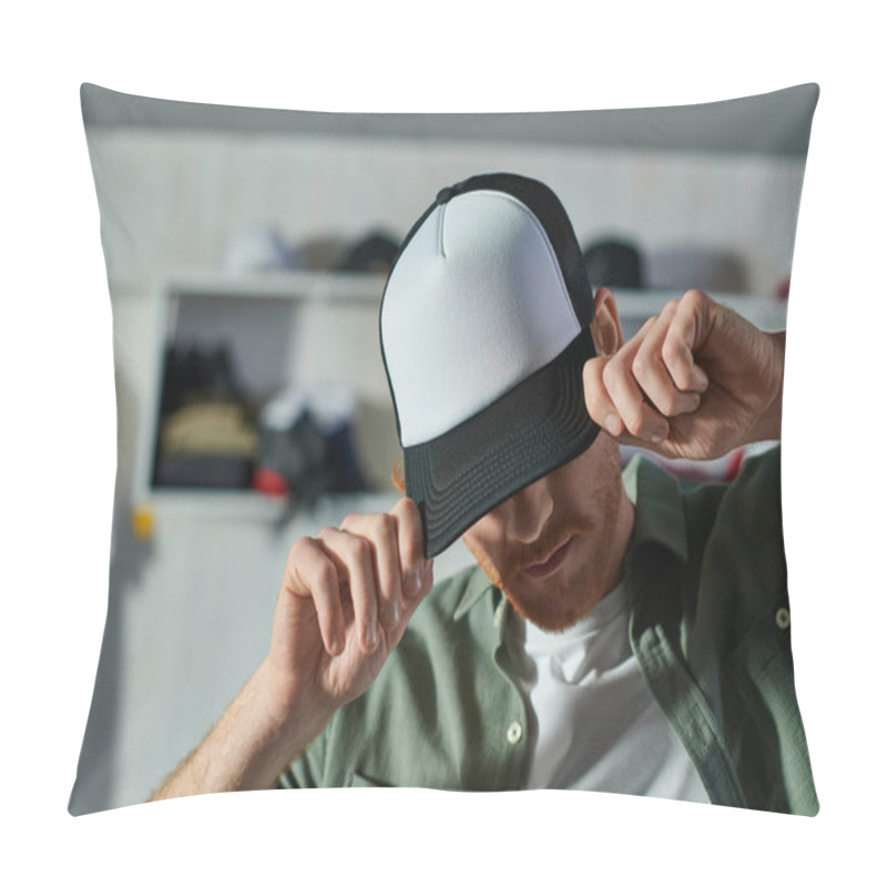 Personality  Young Craftsman Covering Face And Wearing Snapback While Standing And Working In Blurred Print Studio At Background, Customer-focused Entrepreneur Concept  Pillow Covers