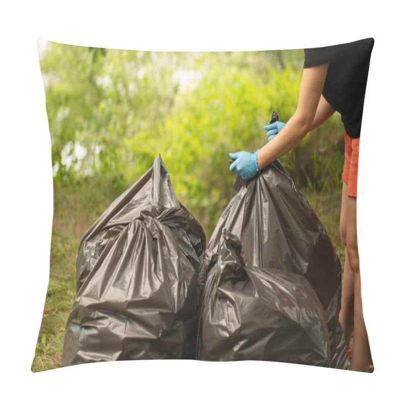 Personality  People Collect Garbage In Bags. Hands Tie A Bag. Collect Garbage In Nature. The Concept Of Cleaning In Nature. Clean The Green Area. Collect Garbage In Gloves. Black Bags. Trash  Pillow Covers