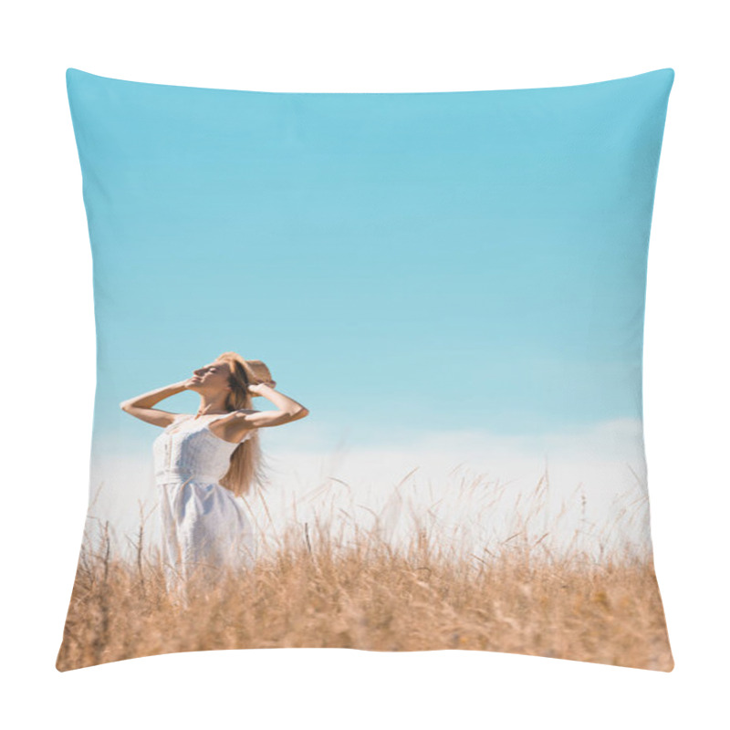 Personality  Selective Focus Of Stylish Woman In White Dress Touching Straw Hat While Standing With Raised Head Against Bule Sky Pillow Covers