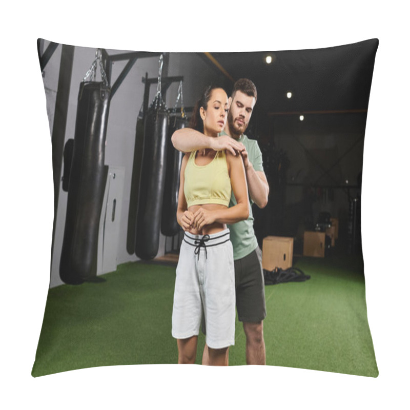 Personality  A Male Trainer Teaches Self-defense Techniques To A Woman In A Gym, Focusing On Strength And Empowerment. Pillow Covers