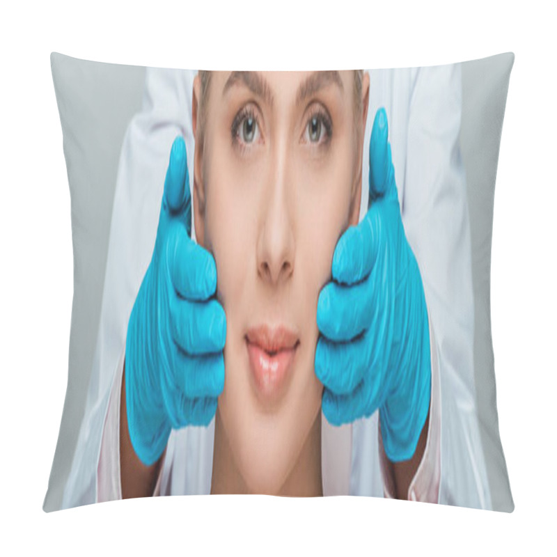 Personality  Panoramic Shot Of Beautician In Blue Latex Gloves Touching Cheeks Of Woman Isolated On Grey  Pillow Covers