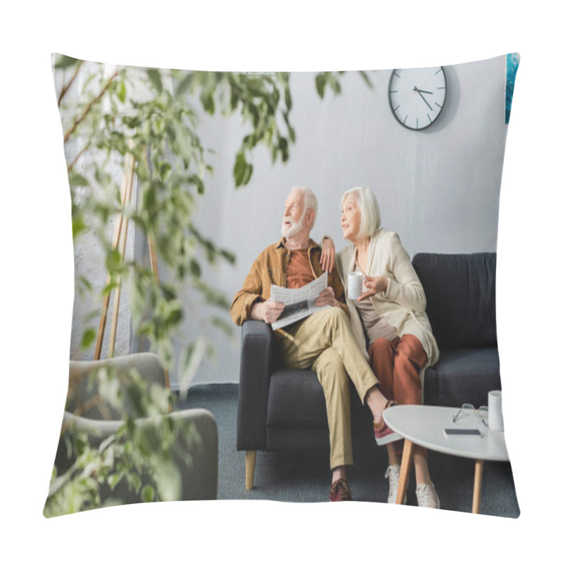 Personality  Selective Focus Of Senior Couple Looking Away While Sitting On Sofa Pillow Covers