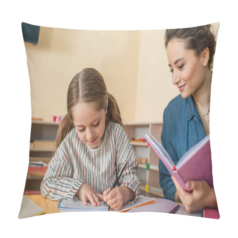 Personality  Happy Teacher Smiling Near Concentrated Girl Writing Dictation In Montessori School Pillow Covers