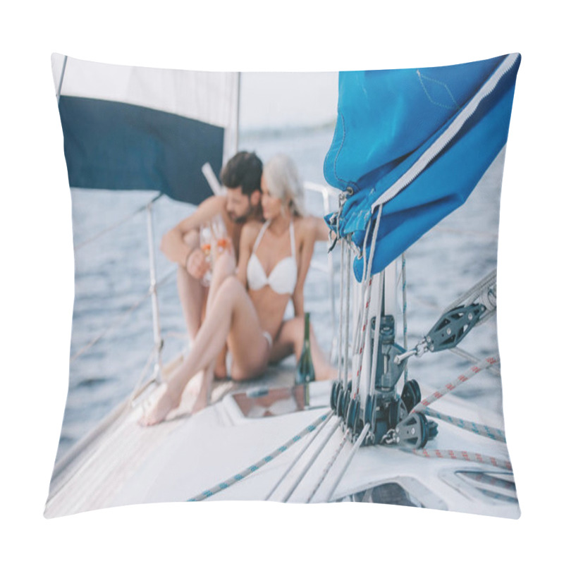 Personality  Selective Focus Of Sail And Couple In Swimwear Relaxing With Champagne Glasses Behind On Yacht  Pillow Covers