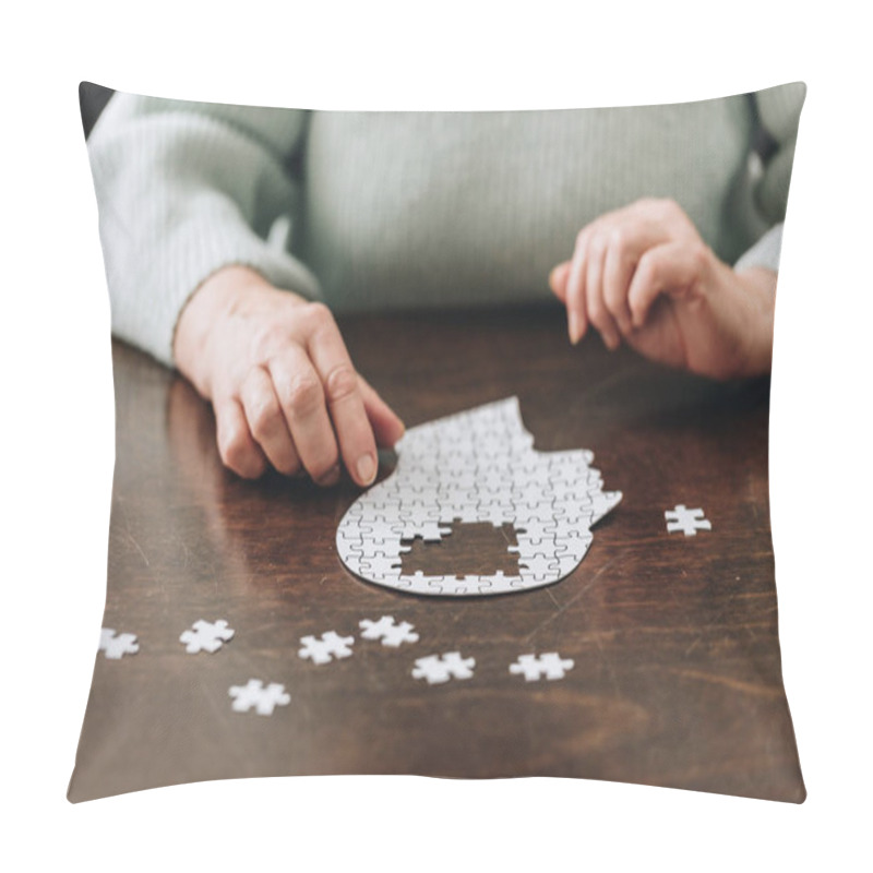 Personality  Cropped View Of Senior Woman Playing With Puzzles On Table Pillow Covers