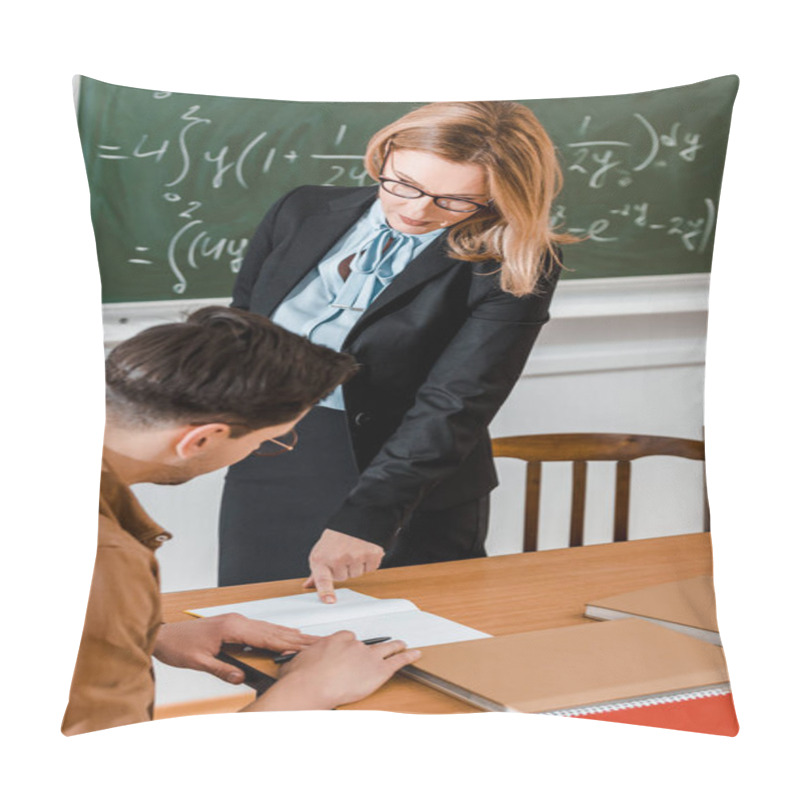 Personality  Female Teacher Pointing At Notebook Near Male Student  Pillow Covers