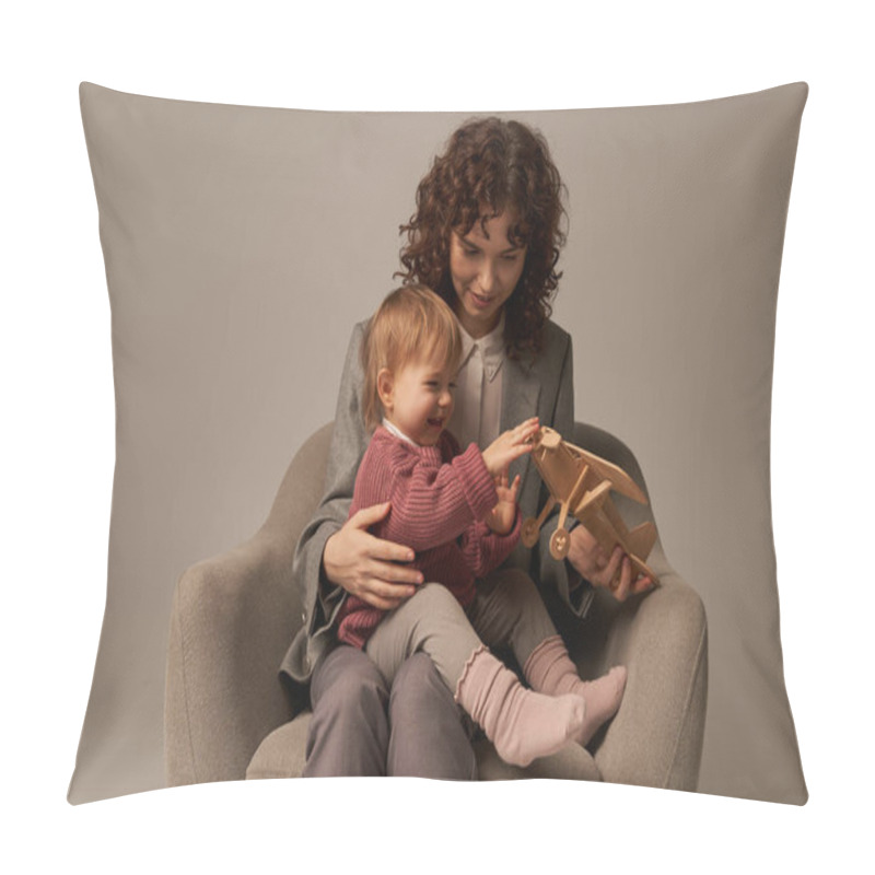 Personality  Modern Working Mother, Balancing Work And Life Concept, Businesswoman In Suit Sitting On Armchair And Playing With Toddler Daughter, Wooden Biplane, Grey Background, Engaging With Child  Pillow Covers