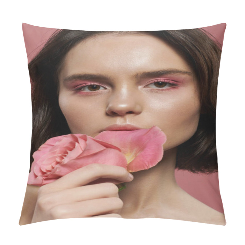 Personality  A Woman Holds A Single Pink Rose Against A Soft Pink Backdrop. Pillow Covers