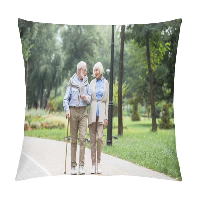 Personality  Happy Senior Couple Talking While Walking In Park Pillow Covers