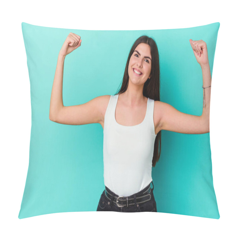 Personality  Young Caucasian Woman Isolated On Blue Background Raising Fist After A Victory, Winner Concept. Pillow Covers