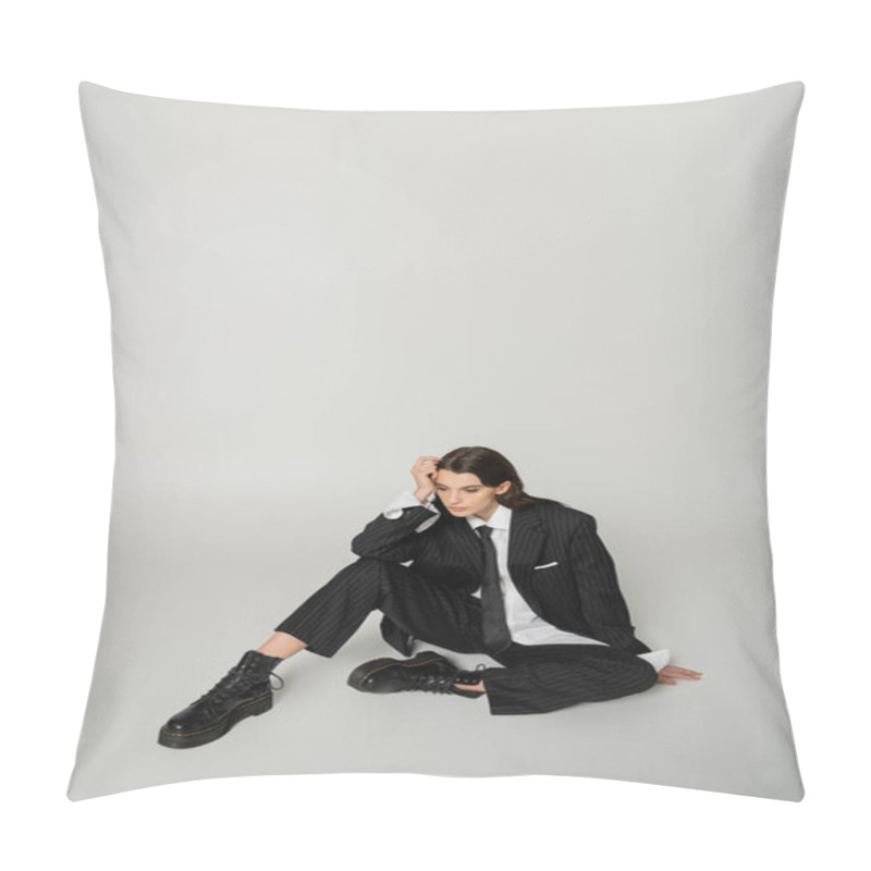 Personality  Pretty Woman In Laced-up Boots And Oversize Formal Wear Sitting With Hand Near Head On Grey Background Pillow Covers