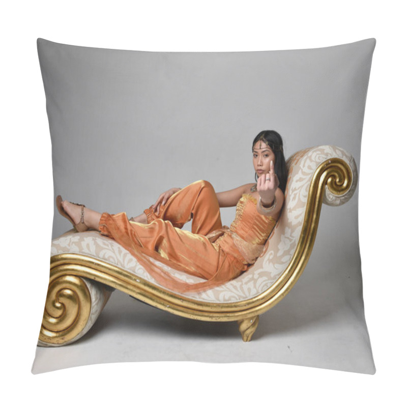 Personality  Full Length Portrait Of Pretty Young Asian Woman Wearing Golden Arabian Robes Like A Genie, Seated Pose On Lounge, Isolated On Studio Background. Pillow Covers