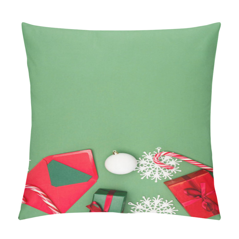 Personality  Top View Of Gift Box, Envelope With Card, Christmas Ball, Candy Canes And Decorative Snowflakes On Green Background With Copy Space Pillow Covers