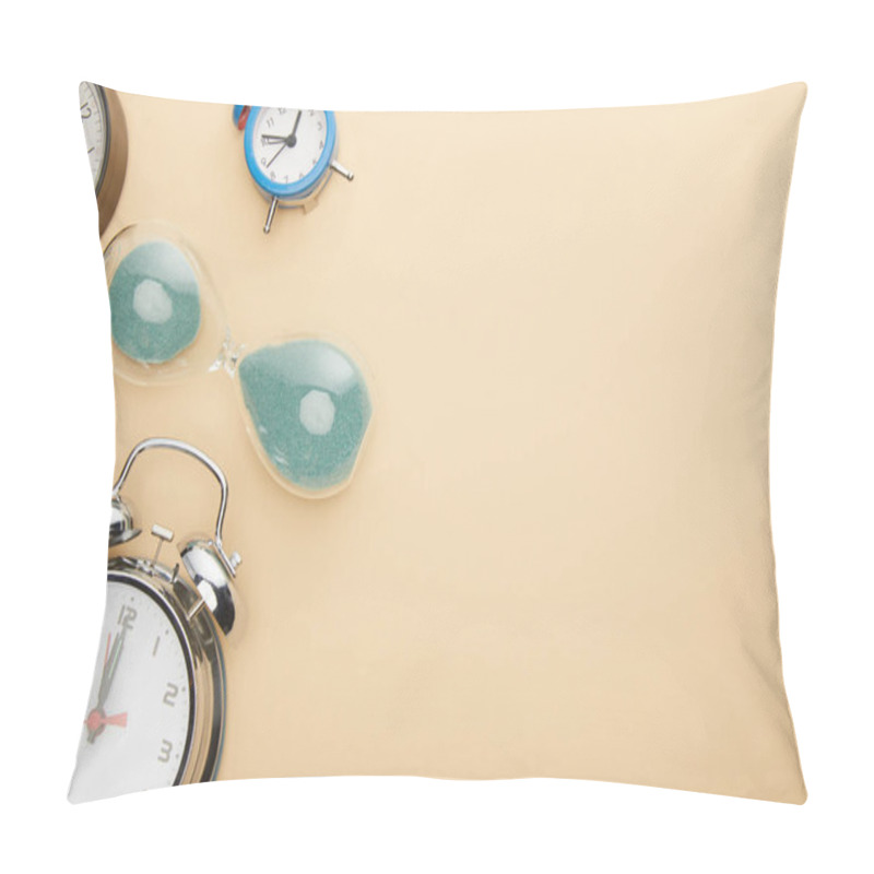 Personality  Top View Of Classic Alarm Clocks And Hourglass On Beige Background Pillow Covers