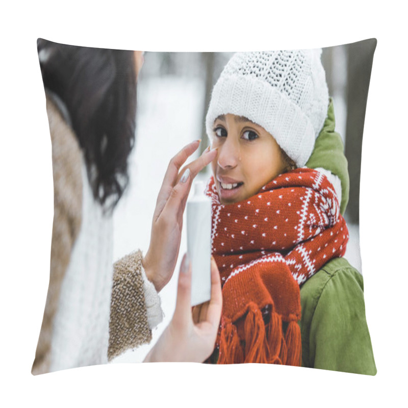 Personality  Cropped View Of Attractive African American Mother Applying Protective Cream On Daughter Nose In Winter Forest Pillow Covers