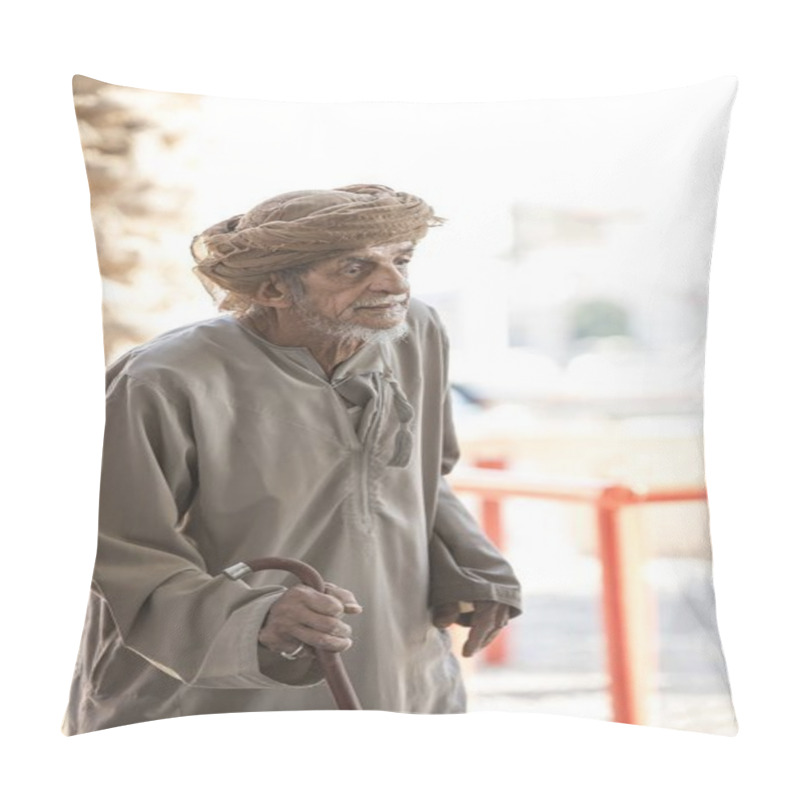 Personality  Nizwa, Oman, 10th November 2017: Omani Old Herdsman Walking Across Goat Market Pillow Covers