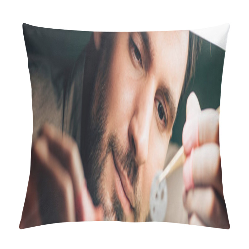 Personality  Panoramic Shot Of Handsome Watchmaker Looking At Watch Part By Lamp Pillow Covers