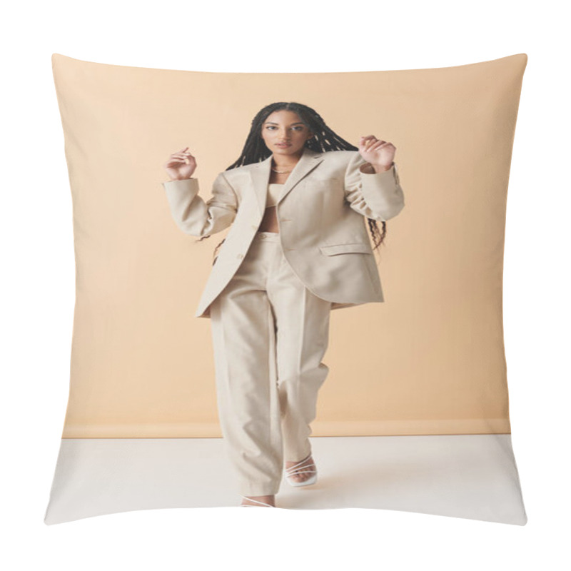 Personality  A Stylish Young Woman With Long Black Braids Stands In A Tan Suit Against A Neutral Background, Posing Confidently In White Heeled Sandals. Pillow Covers