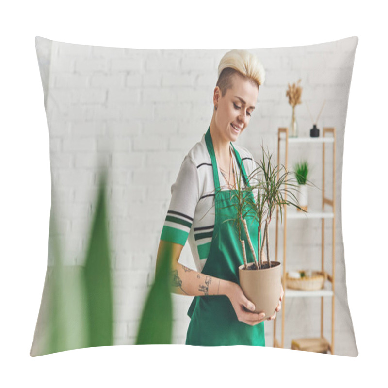 Personality  Environmentally Friendly Habits, Young And Joyful Tattooed Woman In Green Apron Holding Potted Exotic Plant On Blurred Foreground In Modern Apartment, Sustainable Home Decor And Green Living Concept Pillow Covers