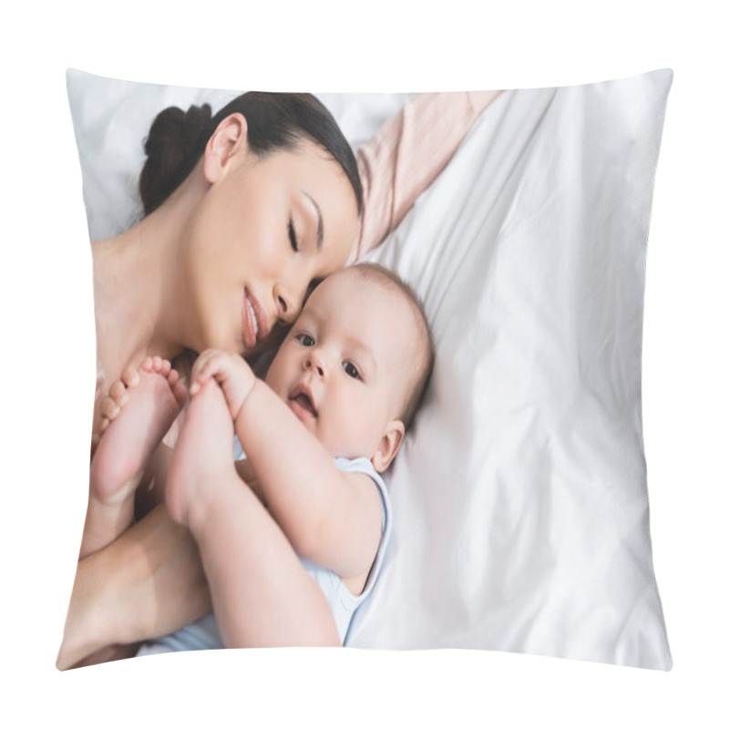 Personality  Overhead View Of Mother With Closed Eyes Lying On Bed With Baby Boy  Pillow Covers