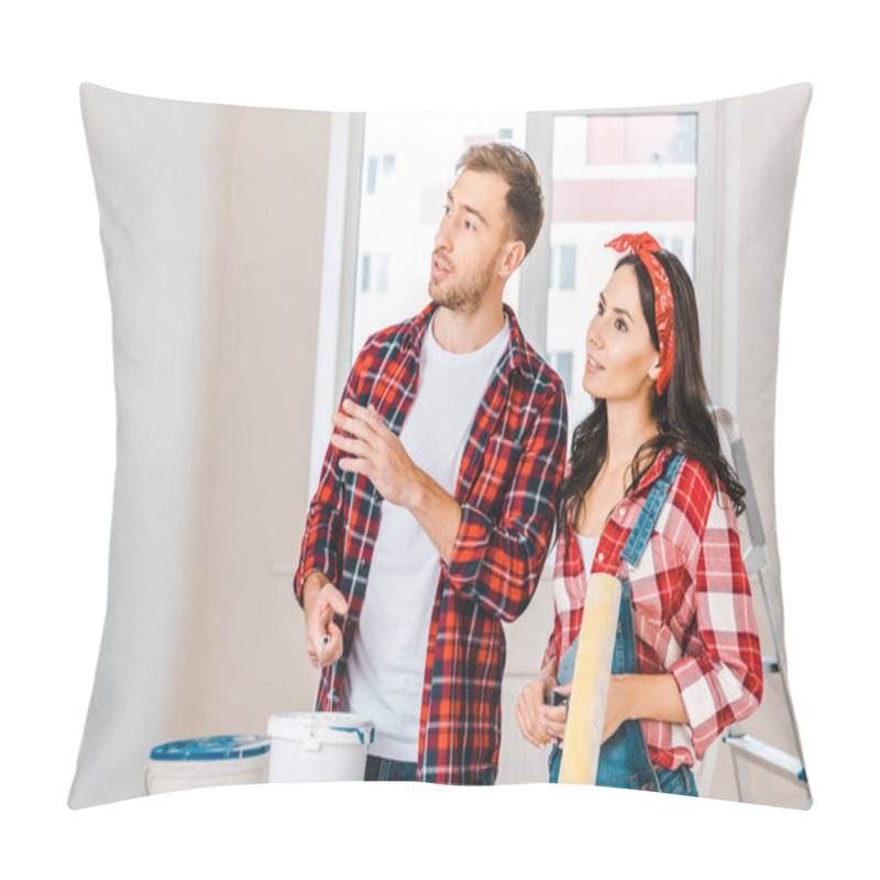 Personality  Happy Couple Holding Paint Bucket And Roller While Talking At Home Pillow Covers