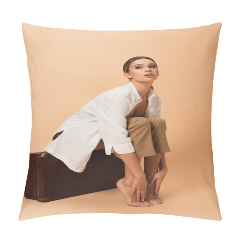 Personality  Young Woman In White Unbuttoned Shirt And Pants Sitting On Retro Suitcase Barefoot On Beige Background Pillow Covers