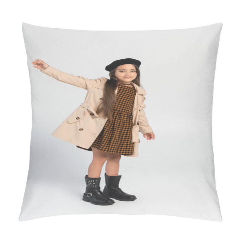 Personality  Full Length Of Cheerful Girl In Stylish Trench Coat And Beret Gesturing While Standing On Grey Pillow Covers