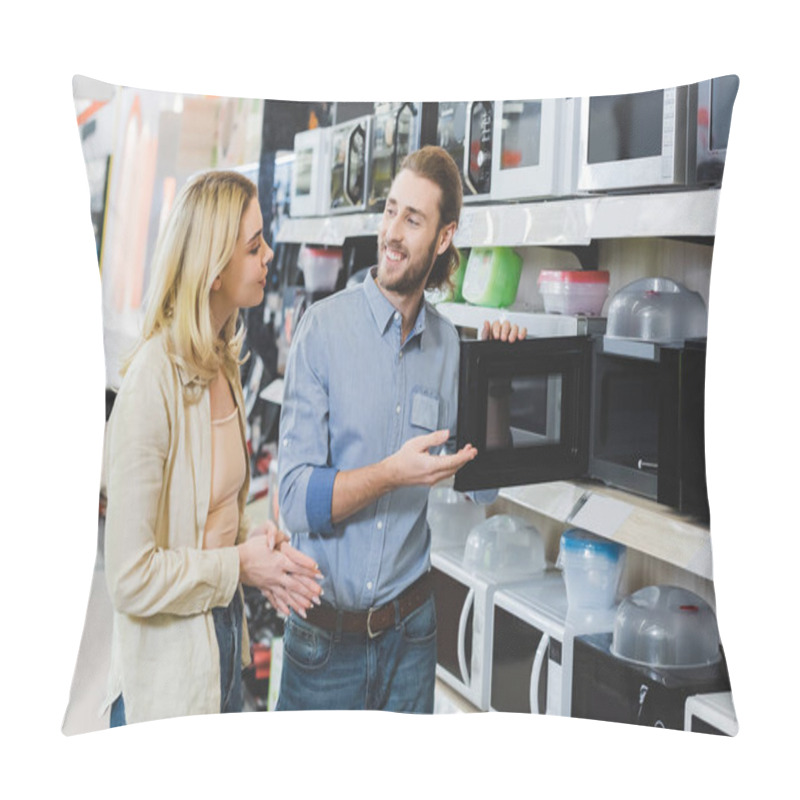 Personality  Smiling Consultant Pointing With Hand At Microwave And Talking With Woman In Home Appliance Store  Pillow Covers