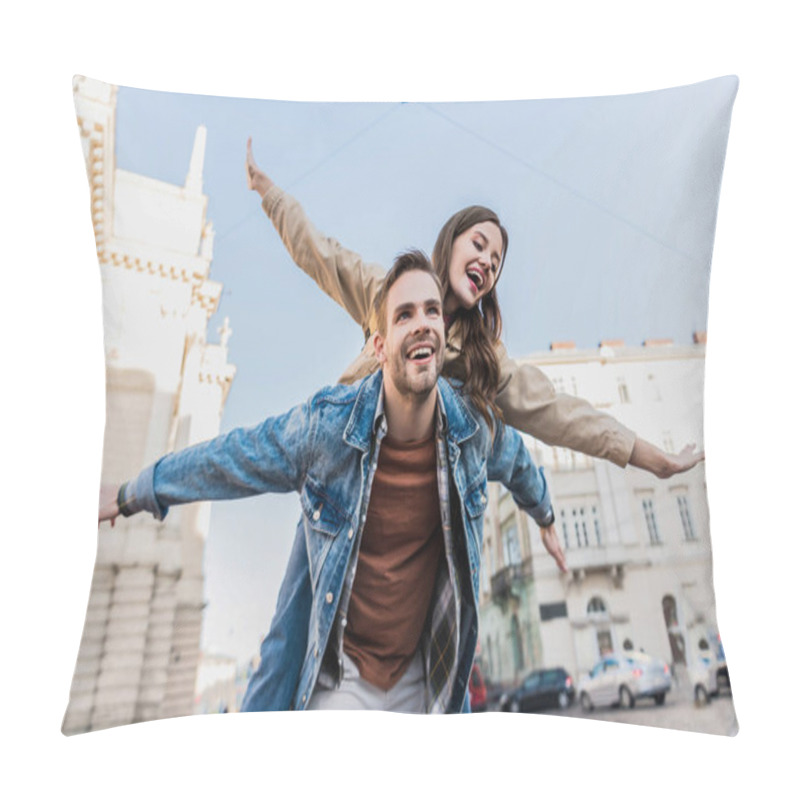 Personality  Low Angle View Of Man Smiling And Piggybacking Excited Girl With Open Arms In City Pillow Covers