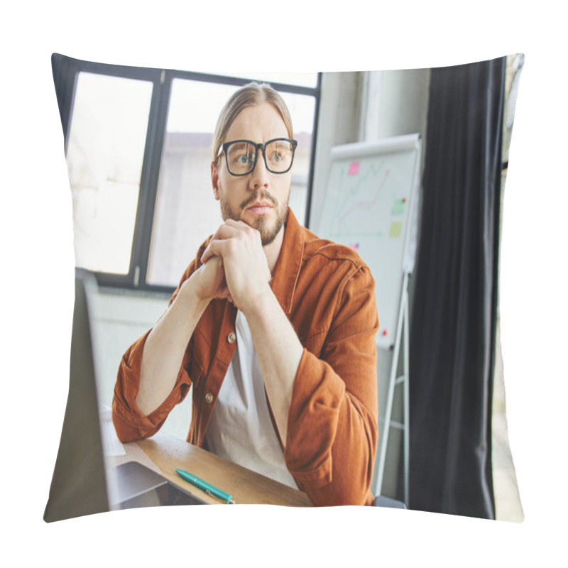 Personality  Stylish And Pensive Businessman In Eyeglasses And Trendy Casual Clothes Looking Away Near Laptop And Pen On Work Desk Next To Flip Chart With Graphs On Blurred Background In Modern Office Pillow Covers