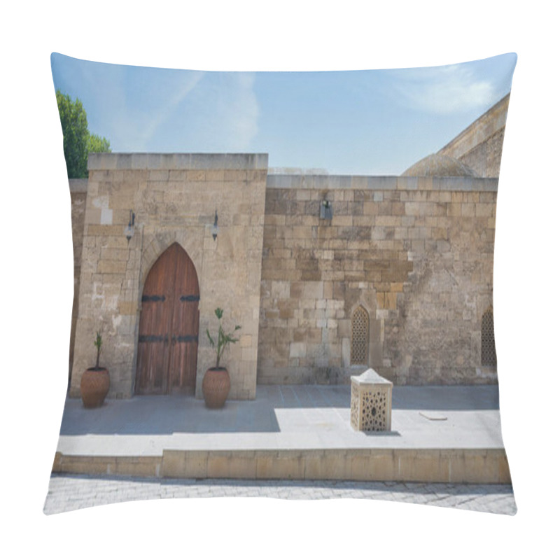 Personality  A Sunlit Courtyard Showcases Ancient Stone Walls And A Beautifully Carved Arched Wooden Door. Decorative Planters And Intricate Lattice Windows Enhance The Historical Atmosphere Pillow Covers