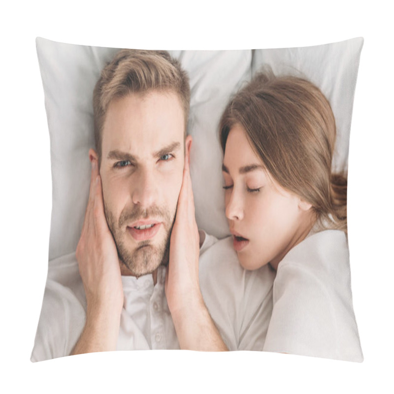 Personality  Displeased Man Plugging Ears With Hands And Looking At Camera While Lying In Bed Near Snoring Wife Pillow Covers