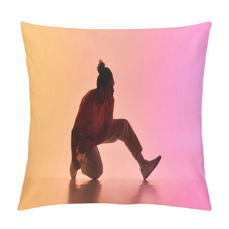 Personality  A Young African American Male Dancer Strikes A Pose Against A Vibrant Gradient Background Of Orange And Pink Neon Lights. Pillow Covers