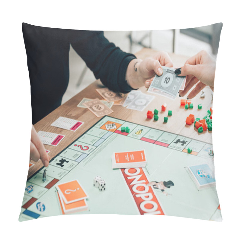 Personality  KYIV, UKRAINE - NOVEMBER 15, 2019: Cropped View Of Women With Toy Currency Playing Monopoly At Table Pillow Covers