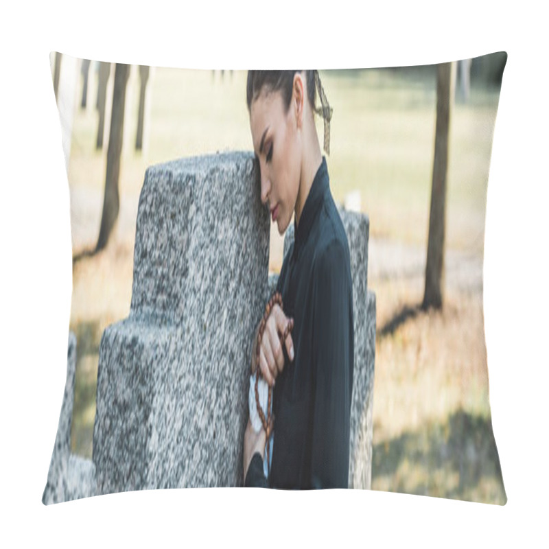 Personality  Panoramic Shot Of Sad Woman Holding Rosary Beads Near Tombs Pillow Covers