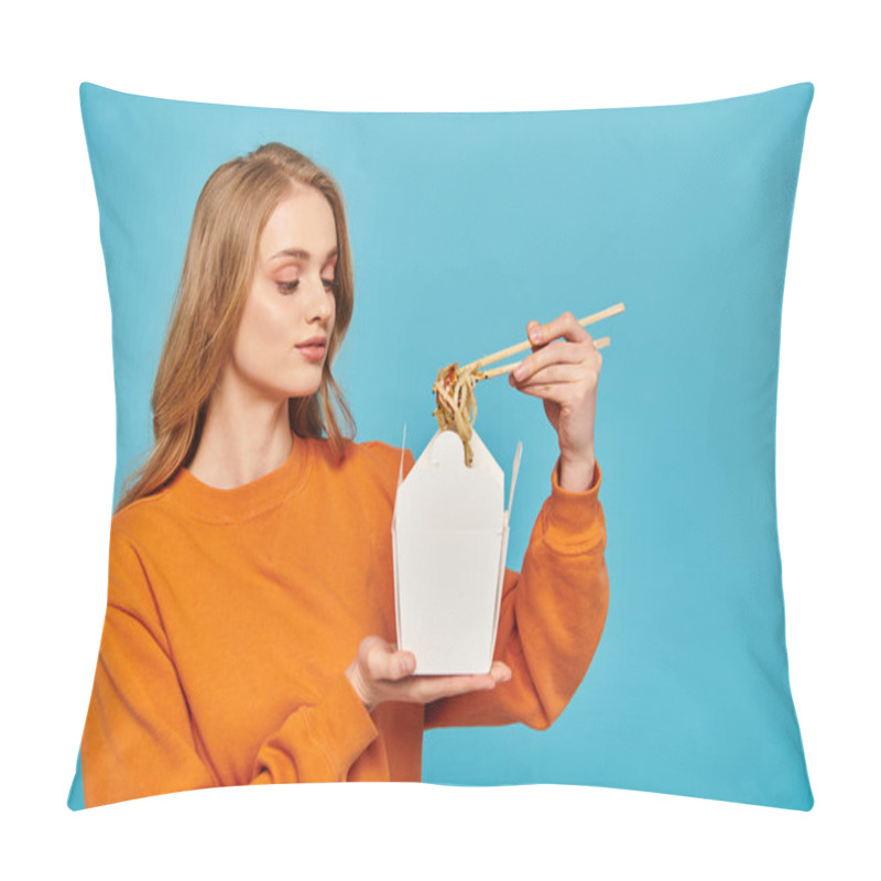 Personality  A Blonde Woman In An Orange Sweater Holds A White Container Filled With Noodles, Showcasing Asian Cuisine With Chopsticks. Pillow Covers