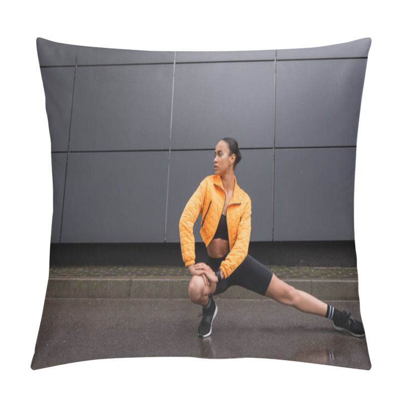 Personality  Full Length Of Stylish African American Sportswoman In Bike Shorts And Yellow Puffer Jacket Stretching Near Grey Building  Pillow Covers