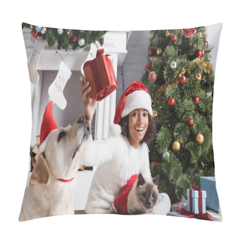 Personality  Excited African American Girl Holding Gift Box While Sitting With Labrador Dog And Cat Near Christmas Tree Pillow Covers