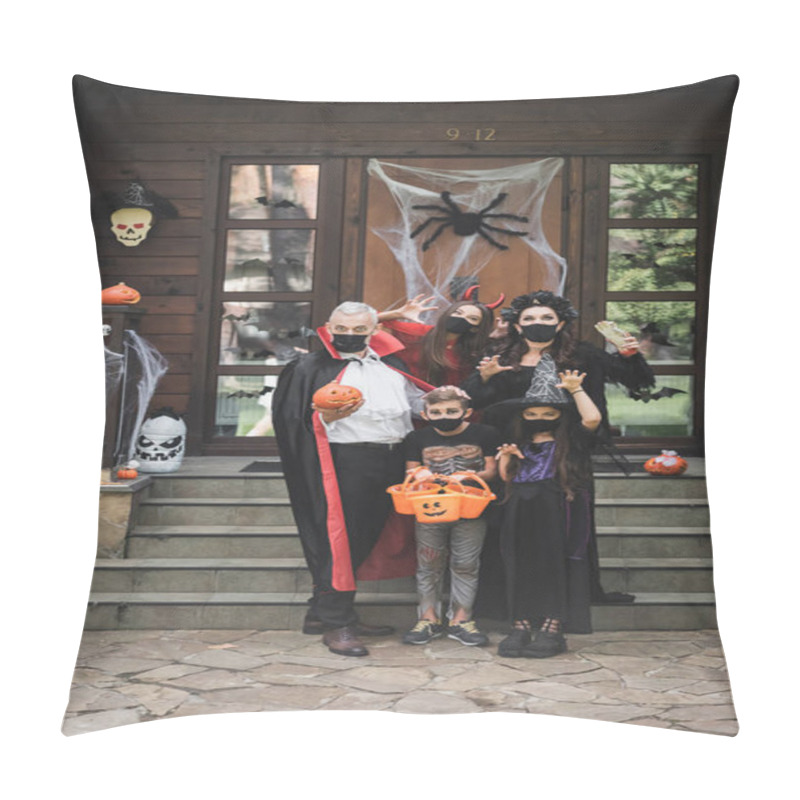 Personality  Creepy Family In Halloween Costumes And Black Medical Masks Showing Scary Gestures Near Porch With Decoration Pillow Covers