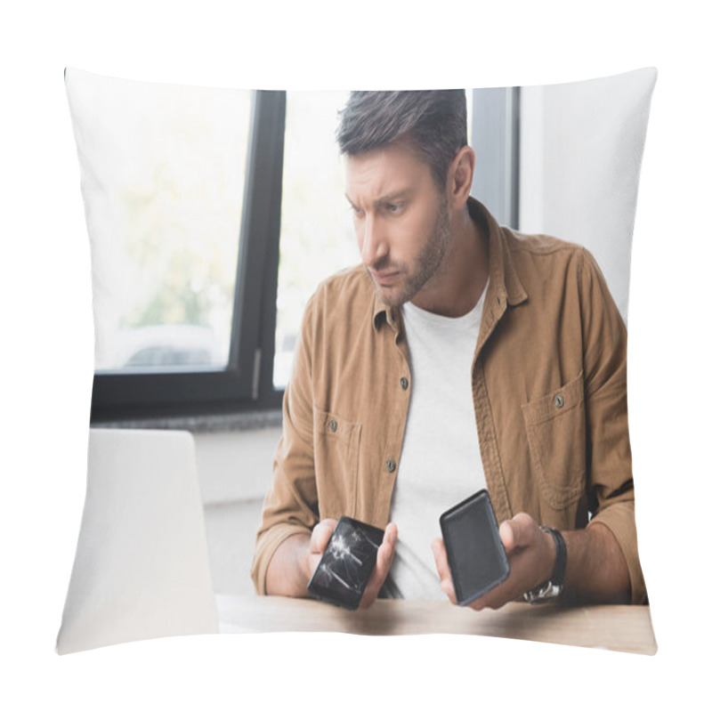 Personality  Serious Businessman With Disassembled Smashed Smartphone, Looking At Laptop At Workplace On Blurred Background Pillow Covers