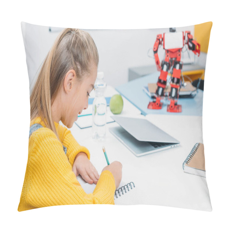 Personality  Schoolgirl Sitting At Desk With Robot Model And Writing In Notebook During STEM Lesson Pillow Covers