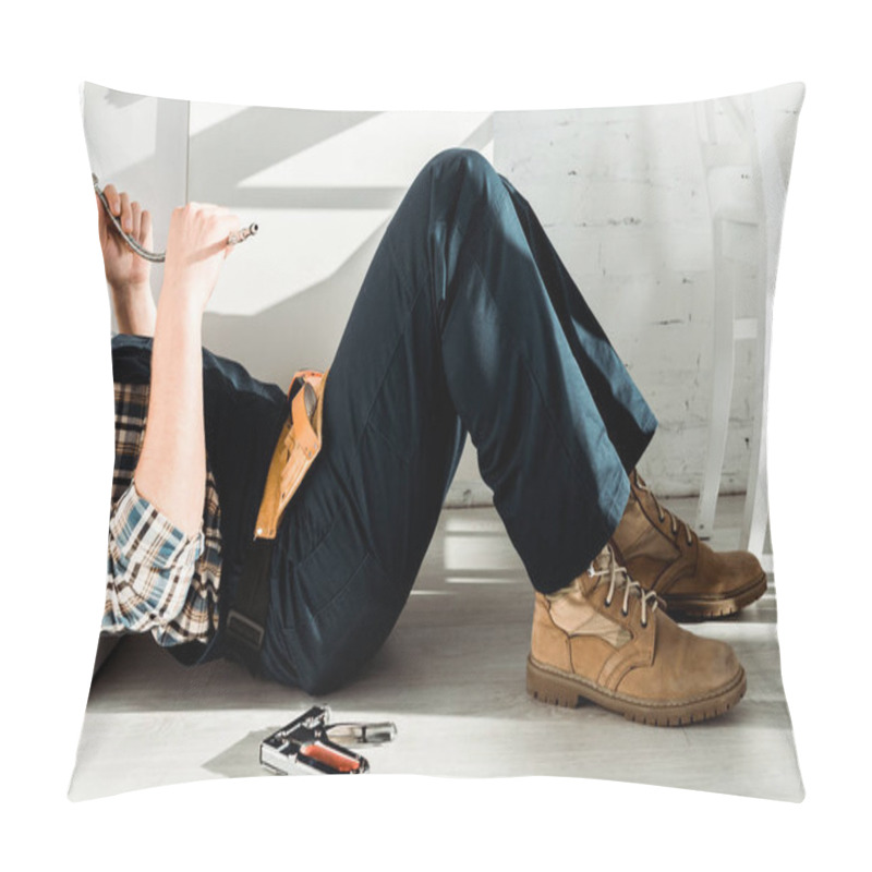 Personality  Cropped View Of Installer Lying On Floor Near Kitchen Cabinet  Pillow Covers