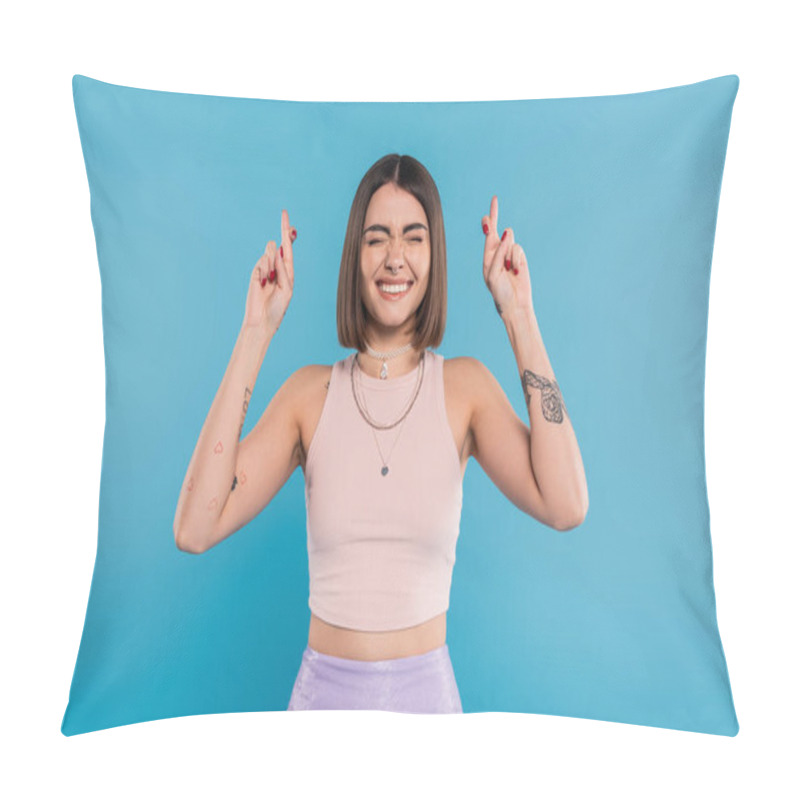 Personality  Fingers Crossed, Tattooed Young Woman With Short Brunette Hair In Tank Top Making Wish On Blue Background, Casual Attire, Gen Z Fashion, Happiness, Smiling With Closed Eyes  Pillow Covers