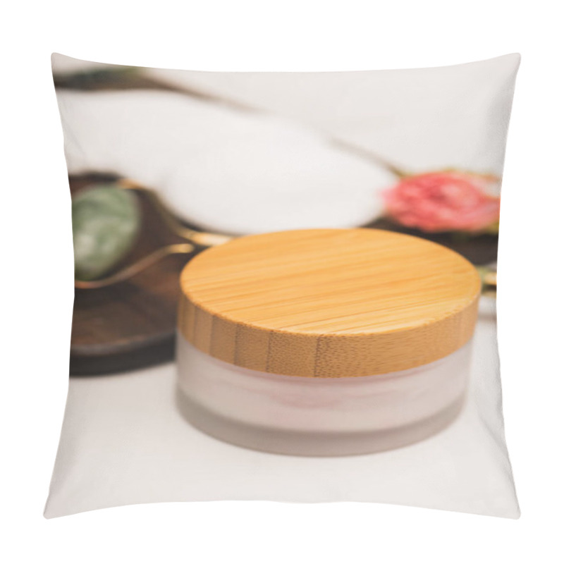 Personality  Container With Cosmetic Cream Near Jade Roller And Cotton Pads On Chopping Board On White Blurred Background Pillow Covers