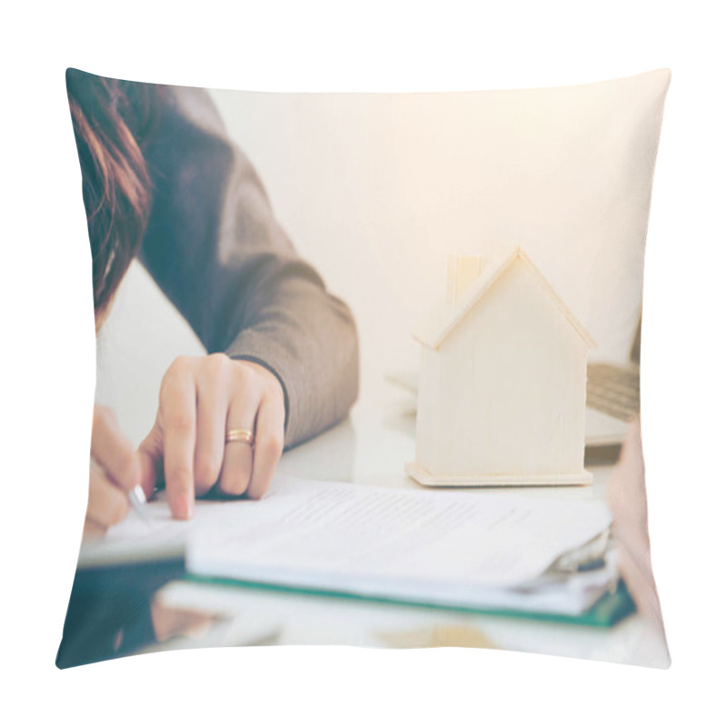 Personality  Client Signs Document Regarding Real Estate Activity Next To Lawyer Or Real Estate Agent Sitting At Office Desk. Business Concept Of Selling And Buying House. Pillow Covers