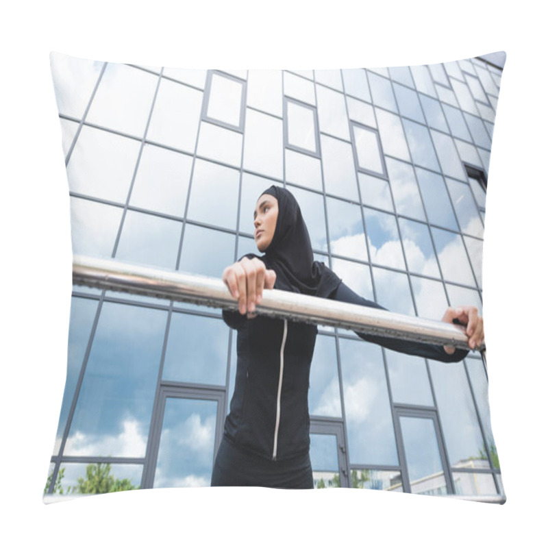 Personality  Low Angle View Of Arabian Woman In Hijab Holding Handrail While Standing Near Modern Building  Pillow Covers